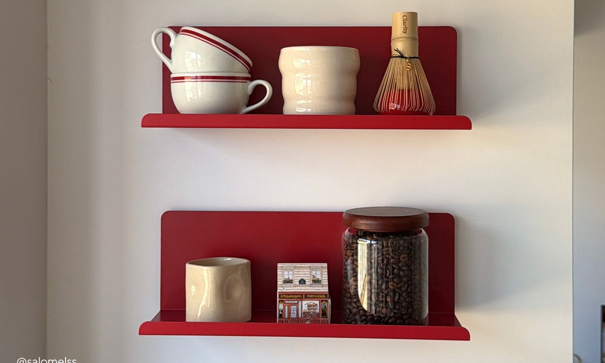 A pair of The Ledge floating shelves in Poppy red, styled as a coffee station with cups, a matcha whisk and a jar of coffee beans