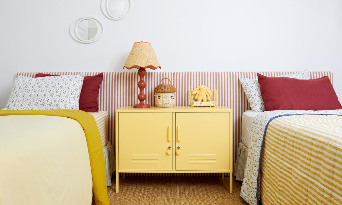a kids room featuring a butter locker with red accessories